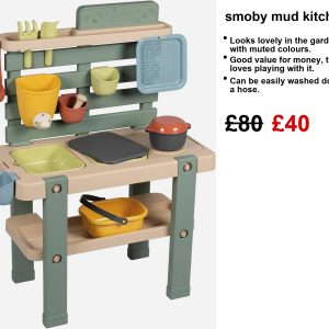 A Smoby Mud Kitchen bursting with colour, perfect for outdoor play! You’ve got a funky water tap, big trays that pop out, and a stash of accessories. Just look at it sitting on the grass—makes you want to dive right in, doesn’t it?